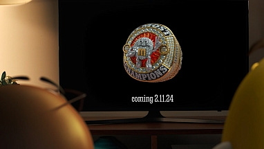 Two M&M's characters watching the M&M'S Almost Champions Ring of Comfort on TV